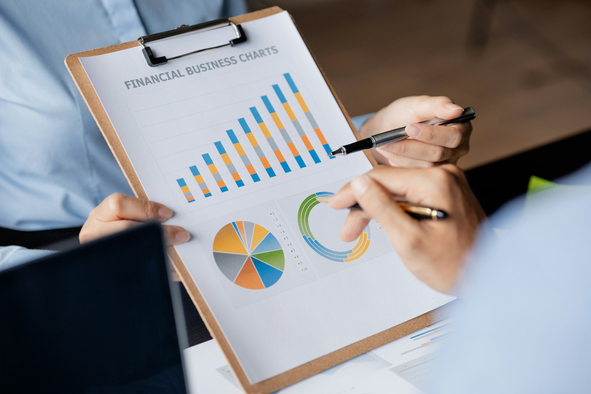 Company meeting room has businessmen and finance managers meeting together on finance topics.