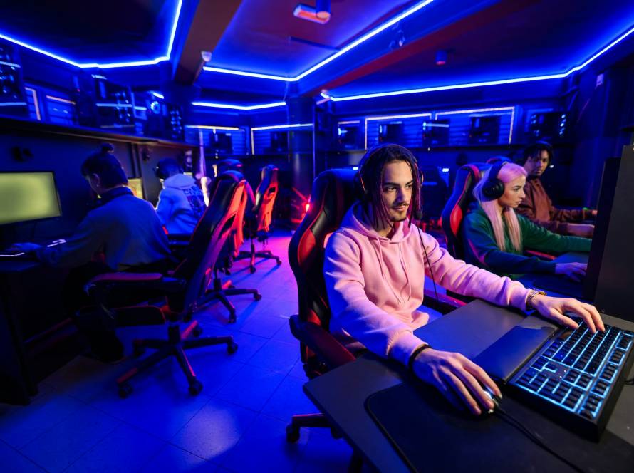 Professional esport team is practicing for tournament in cybercafe.